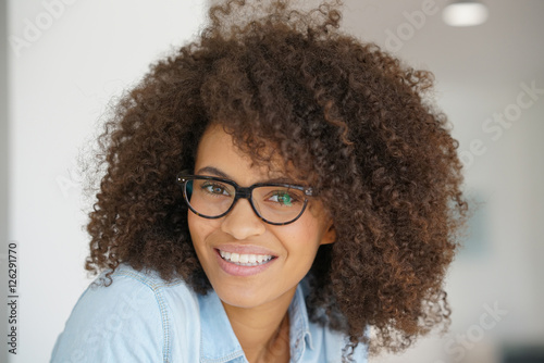 Portrait of attractive mixed-race woman with eyeglasses