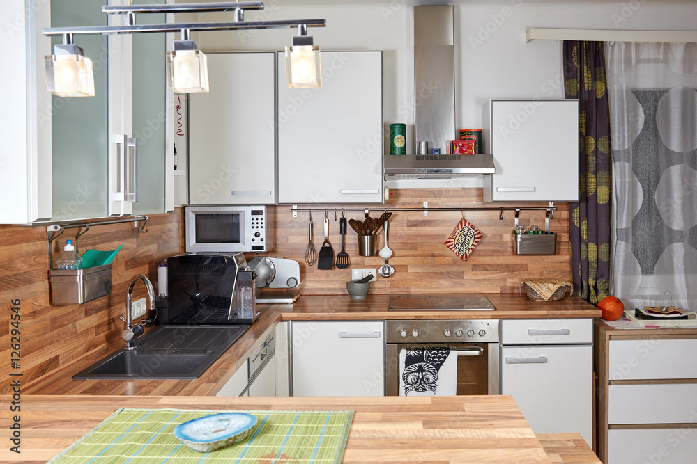 Interior of a modern kitchen with white furniture Interior of a modern kitchen with white furniture