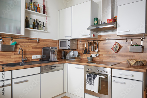 Interior of a modern kitchen with white furniture