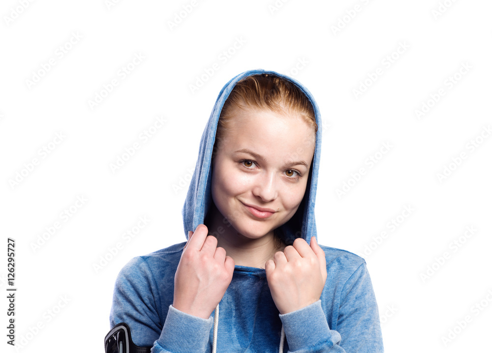 Teenage girl in blue sweatshirt. Studio shot, isolated. Teenage girl in blue sweatshirt. Studio shot, isolated.