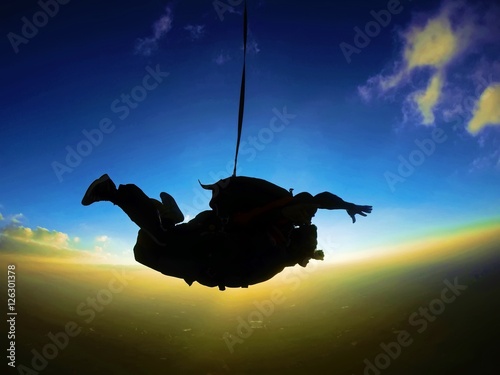 Skydiving tandem sunset silhouette