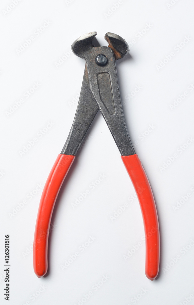 Pliers with red handles on a white background Pliers with red handles on a white background