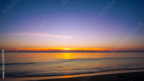 Sunset on the beach with blue sky © k_samurkas