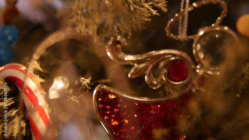 A slow dolly shot of Christmas ornaments on tree macro shot A slow dolly shot of Christmas ornaments on tree macro shot