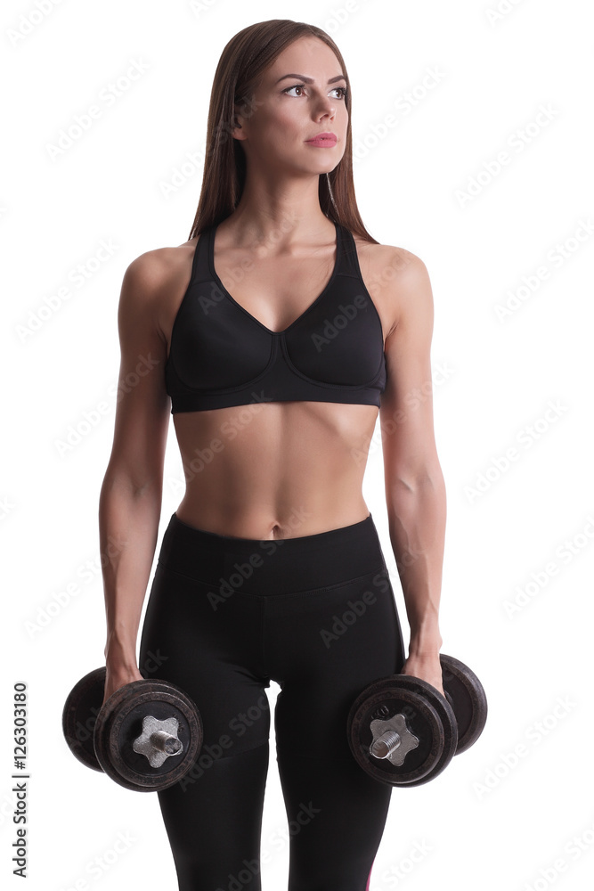 sporty muscular woman working out with dumbbells sporty muscular woman working out with dumbbells