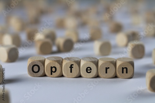 Tableau sur toile Opfern - Holzwürfel mit Buchstaben