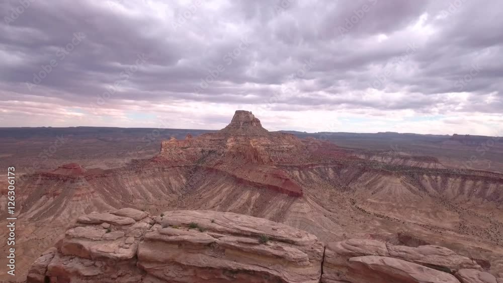 Amazing aerial shot flying over tall cliff and butte Amazing aerial shot flying over tall cliff and butte