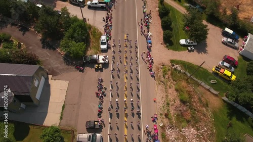 Aerial shot of families watching marching band in small parade photo