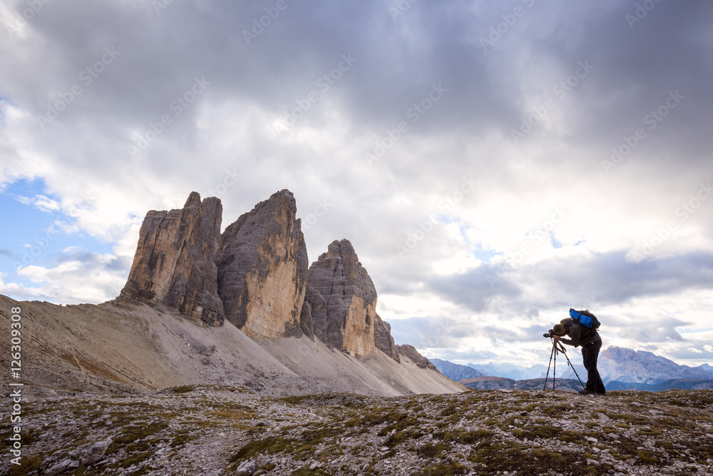 Photographer taking photo for beautiful landscape on mountain pe