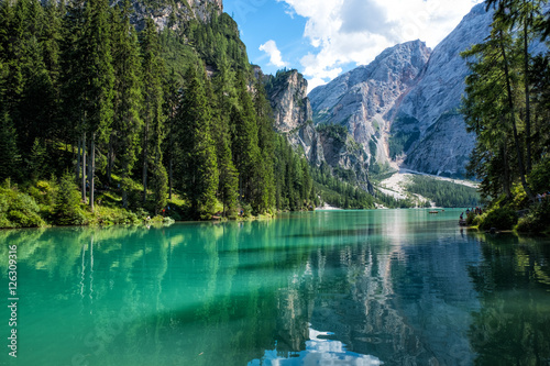 View of scenic turquoise Lake Braies in the Dolomites with the mountain in the background, Sudtirol, Italy. 