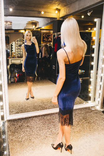 Woman making selfie in front of the mirror