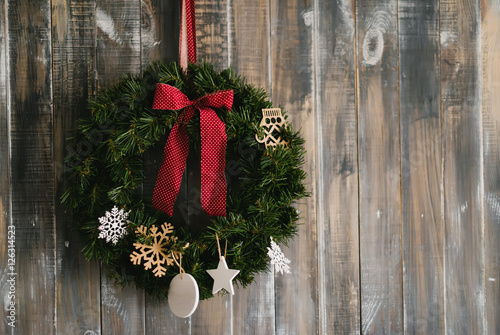 Christmas wreath on a wooden background
