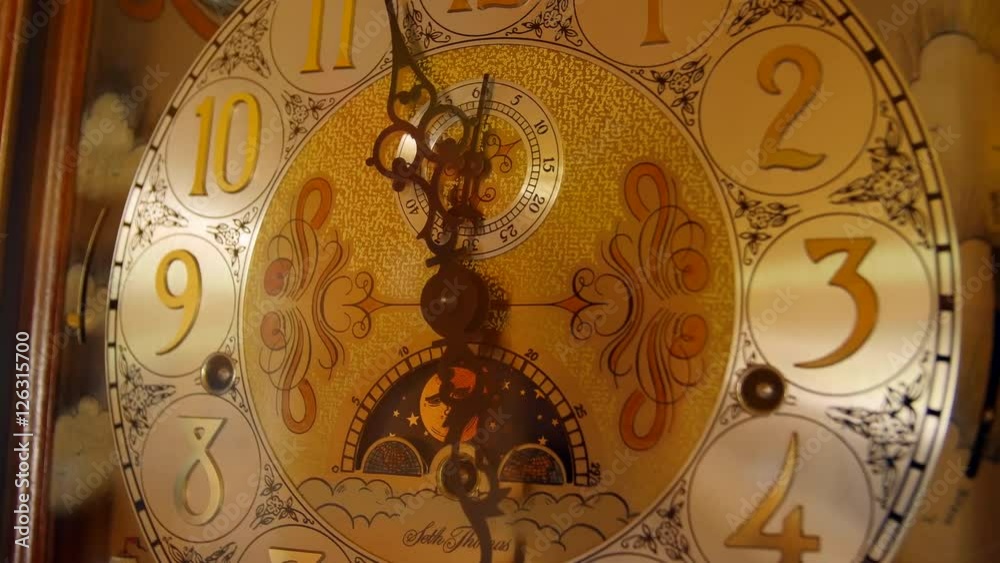 A cool old grandfather clock face in the living room