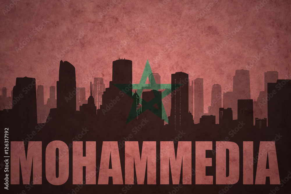 abstract silhouette of the city with text Mohammedia at the vintage moroccan flag