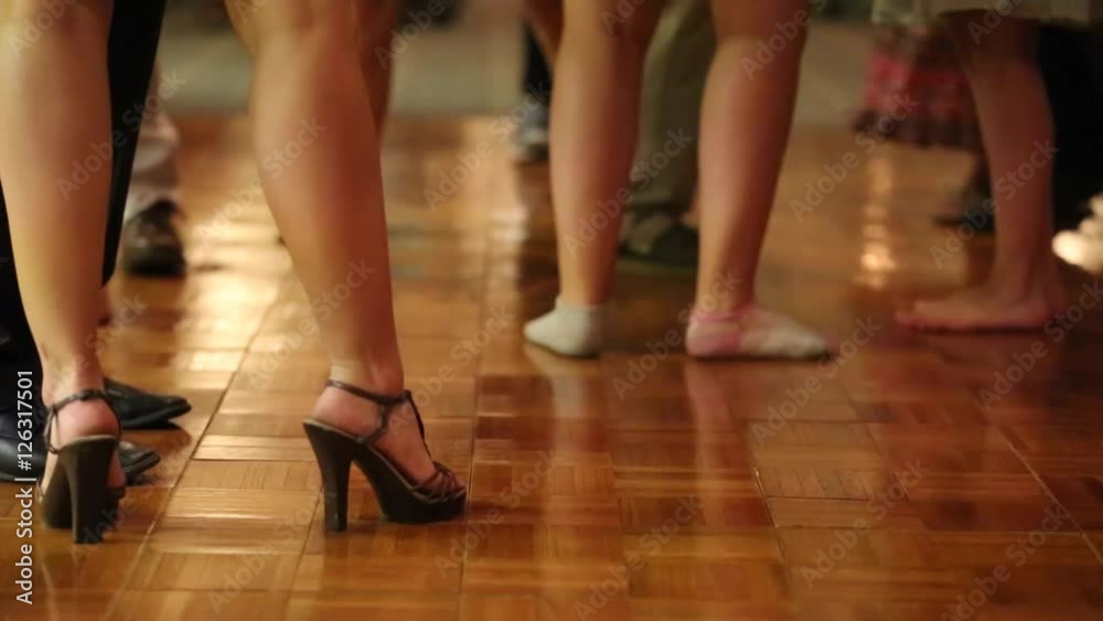 Couples dancing during a wedding reception to music Couples dancing during a wedding reception to music