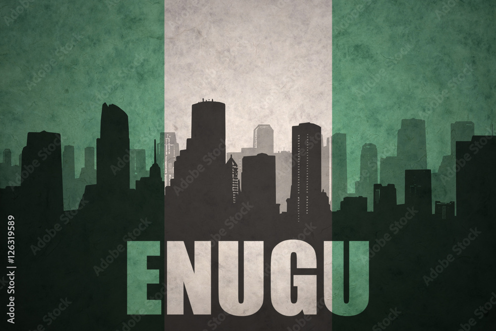 abstract silhouette of the city with text Enugu at the vintage nigerian flag