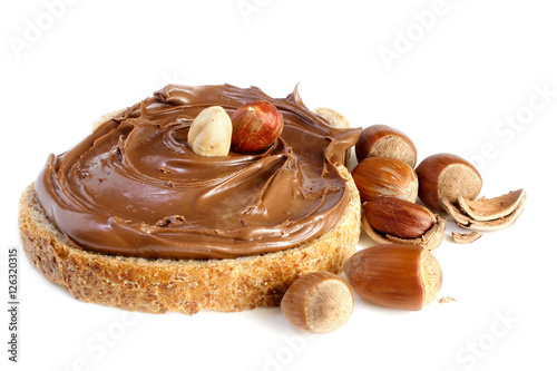 Obraz na plátně Bread with sweet chocolate hazelnut spread isolated on white background