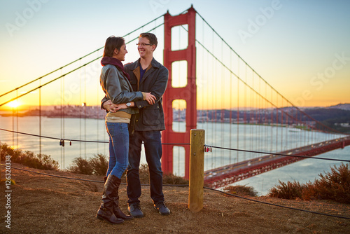 Photography couple together at golden gate bridge in love