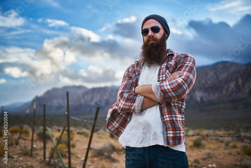 rugged bearded man in rural nevada posing