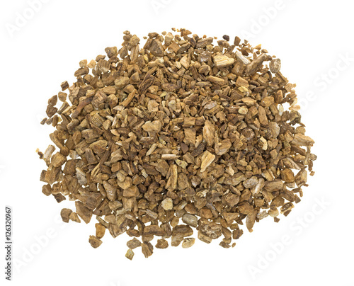 Dried cut and sifted burdock root top view isolated on a white background.