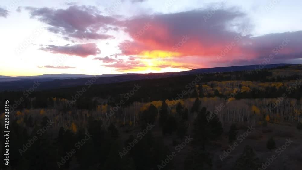 Aerial dolly shot of a beautiful mountain sunset and fall colors Aerial dolly shot of a beautiful mountain sunset and fall colors