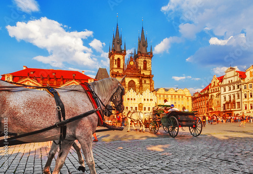 Prague, classical view on central square with white horses on foreground. Czech Republic.