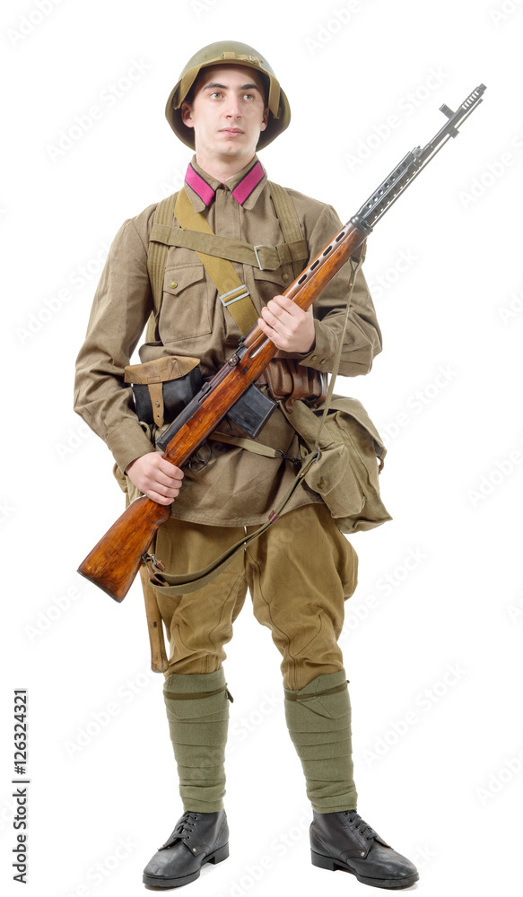 young Soviet soldier with rifle on the white background young Soviet soldier with rifle on the white background