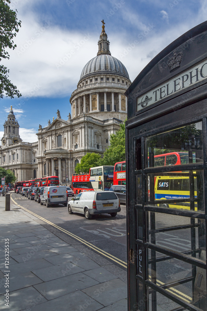 LONDON, ENGLAND - JUNE 15 2016:St. Paul Cathedral and Phone booth in London, Great Britain