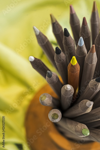 Pile of Color Pencils 
Gray color pencils and one of them with yellow color
