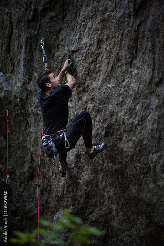 Wallpaper Mural Rock climber ascending a challenging cliff. Extreme sport climbing. Freedom, risk, challenge, success.  Torontodigital.ca