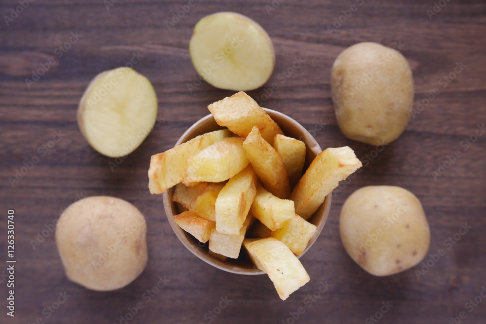 Homemade french fries raw organic potatoes from a home garden Homemade french fries raw organic potatoes from a home garden