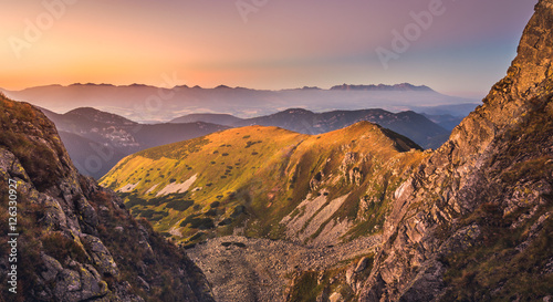 Mountain Landscape in Colourful Sunset. View from Mount Dumbier in Low Tatras, Slovakia. West and High Tatras Mountains in Background. © kaycco