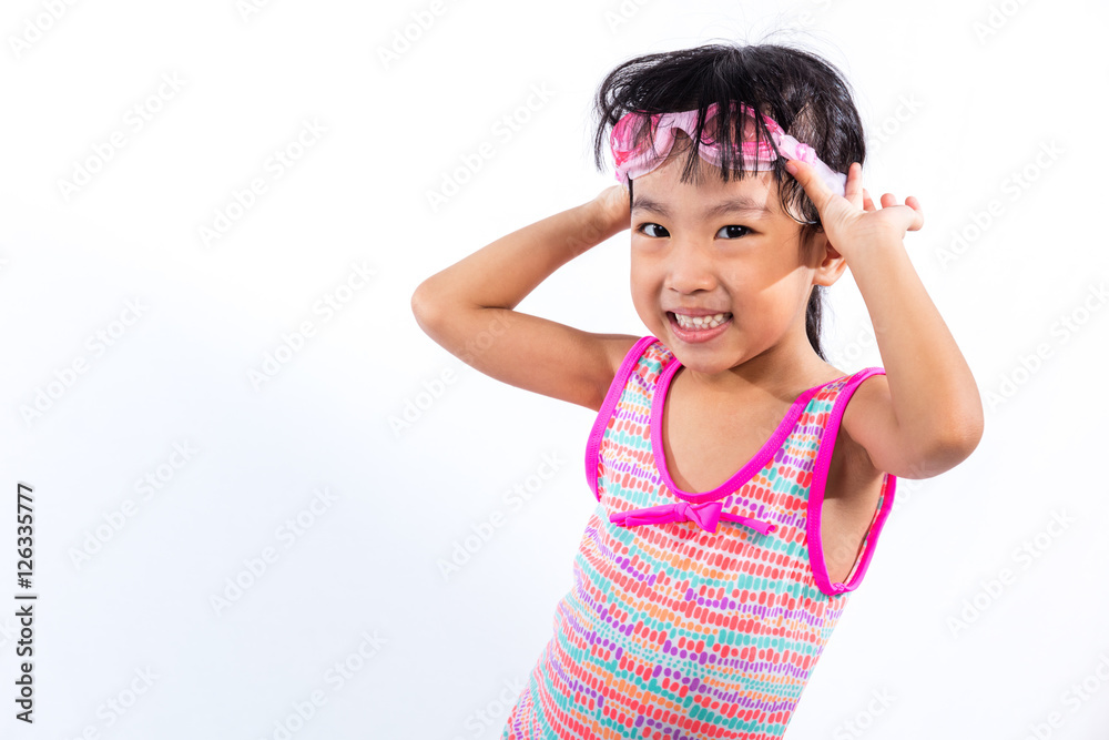 Asian Chinese little girl portrait wearing goggles and swimsuit