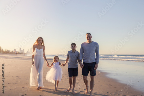 Family of four portrait on the beach, very soft selective focus, toning
