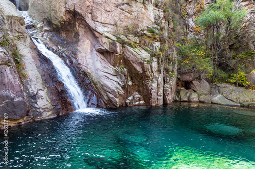 Waterfall in Bei Jiu Shui trail in Autumn, Laoshan Mountain, Qingdao, China. Bei Jiu Shui is famous for the many pools of crystal clear water and it's waterfalls