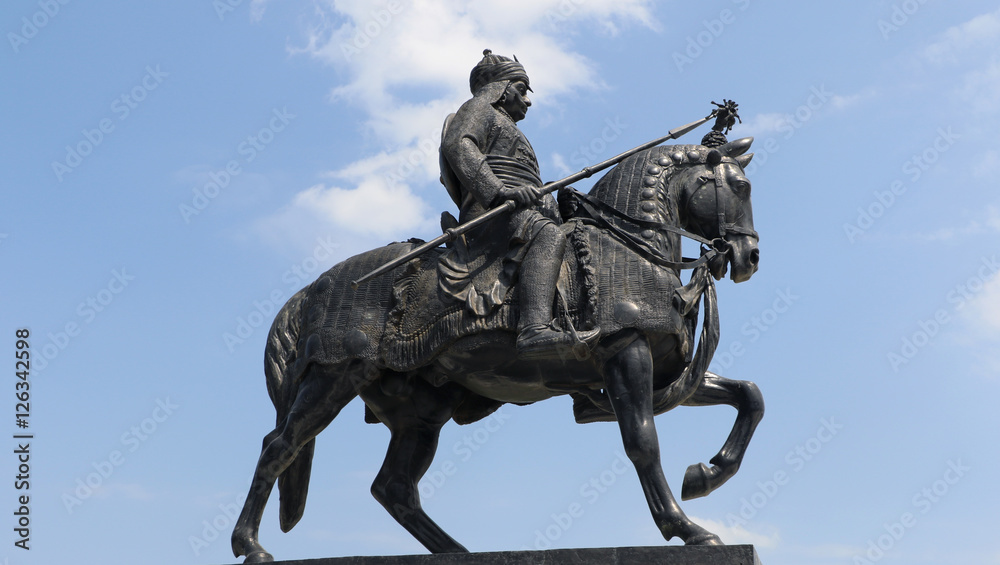 Life-sized bronze statue of Maharana Pratap at Maharana Pratap Memorial, Udaipur, Rajasthan balanced on his loyal and favorite horse, Chetak.