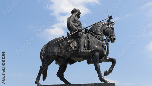 Life-sized bronze statue of Maharana Pratap at Maharana Pratap Memorial, Udaipur, Rajasthan balanced on his loyal and favorite horse, Chetak. photo
