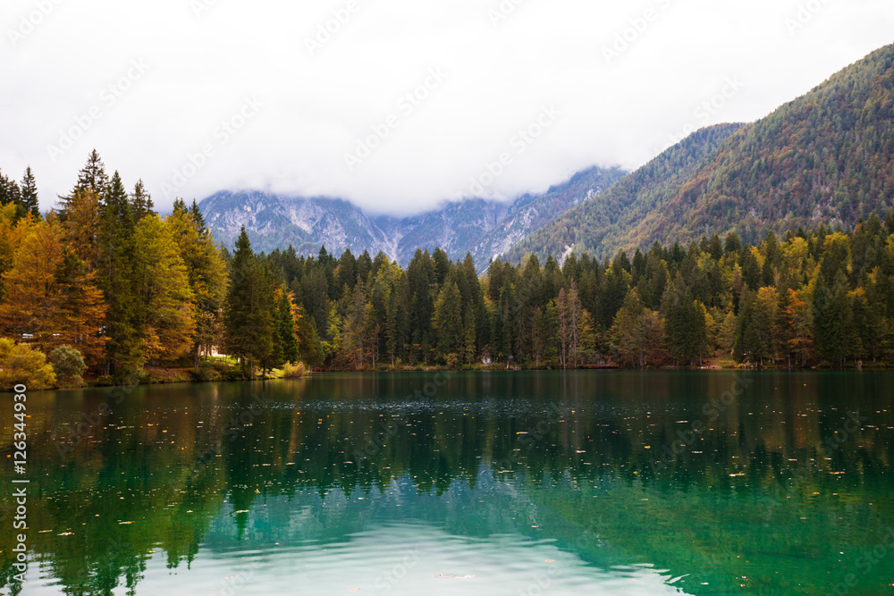 Autumn scenery at lake Fusine mountain lake