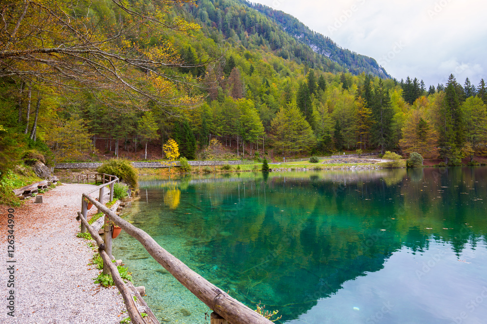 Fototapeta premium Autumn scenery at lake Fusine mountain lake