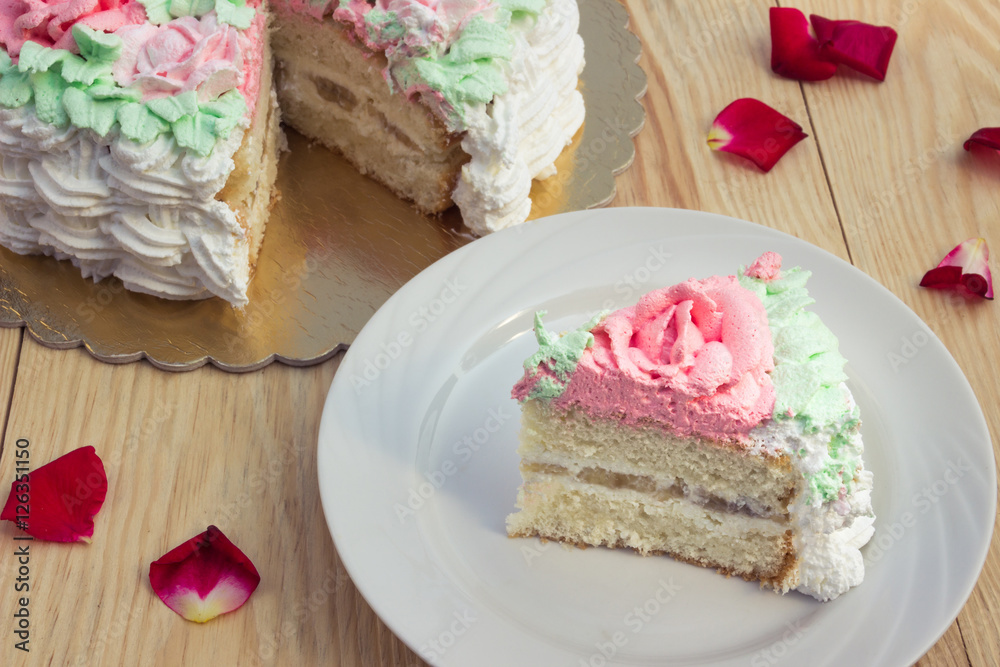 piece of sponge cake with curd cream and banana on background piece of sponge cake with curd cream and banana on background
