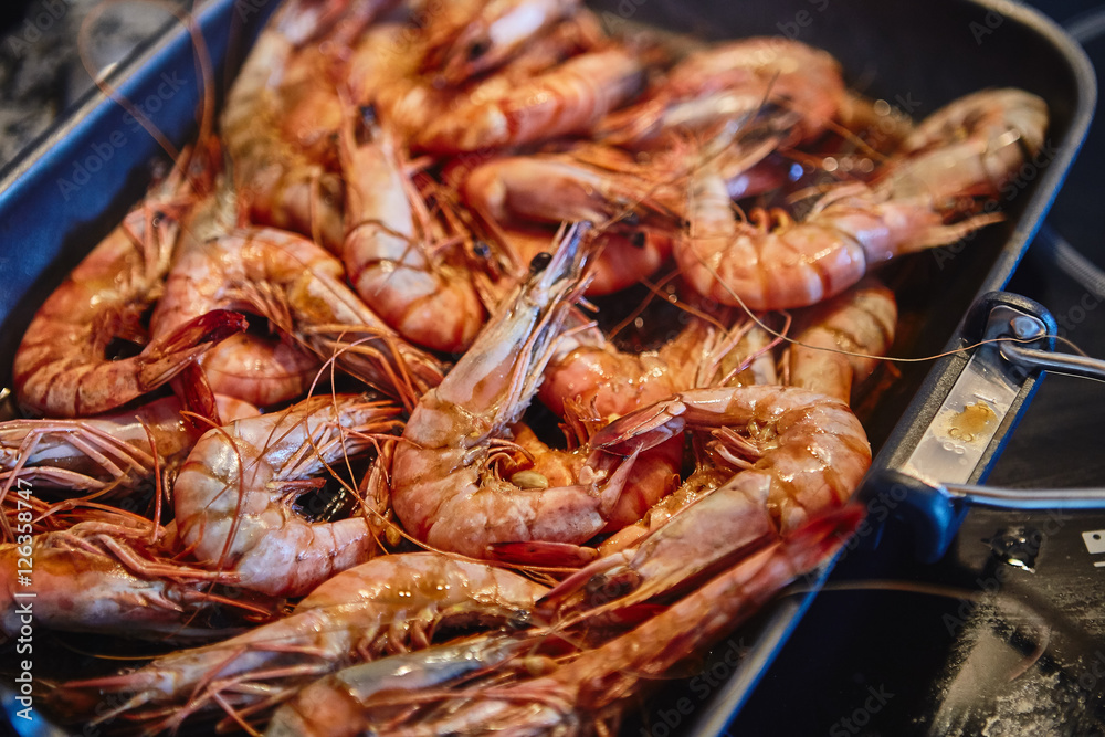 Cooking tiger prawns grilled. Close-up. Background. Cooking tiger prawns grilled. Close-up. Background.