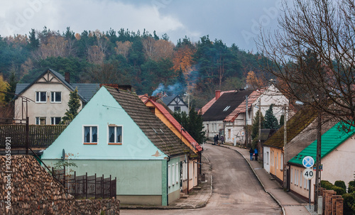 Obraz na płótnie Cold autumn day in the town of Tuczno, Poland. Smoke coming from houses' chimneys w salonie