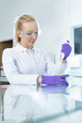 Young pretty girl in the modern laboratory