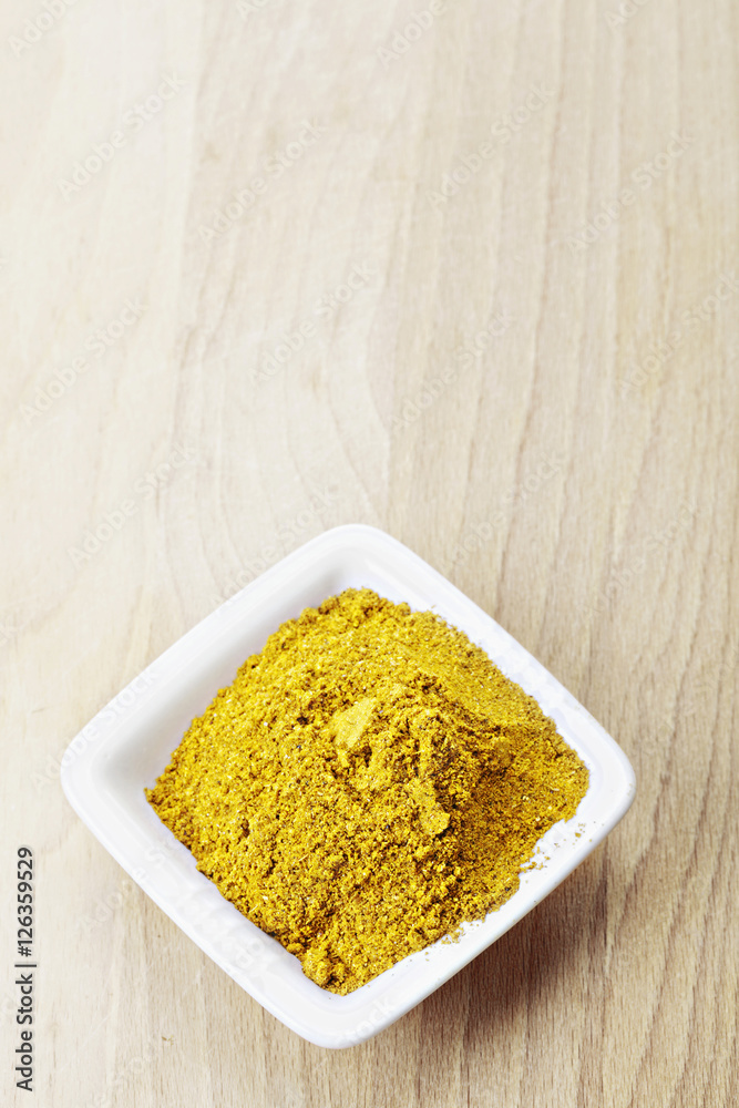 Grounded khmeli suneli spice mixture on wood Grounded khmeli suneli spice mixture on wood