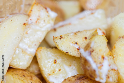 Baked potato slices with spices