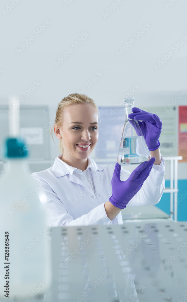 Fototapeta premium Portrait of a female researcher doing research in a lab