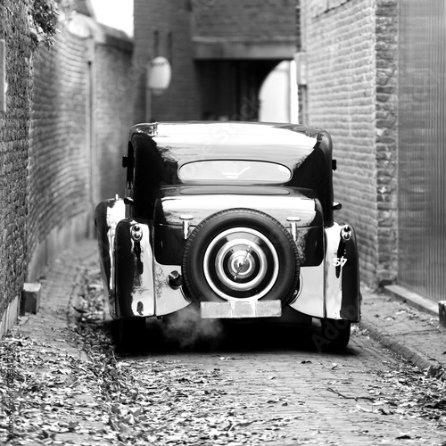 oldsmobile/ oldsmobile standing in a street photo