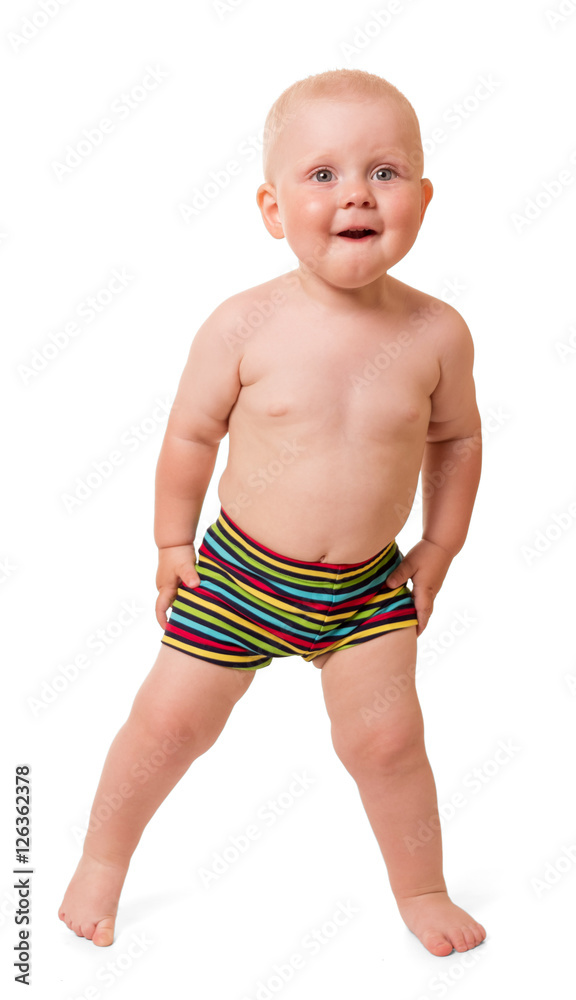 The charming little boy in swimming trunks isolated on white. The charming little boy in swimming trunks isolated on white.