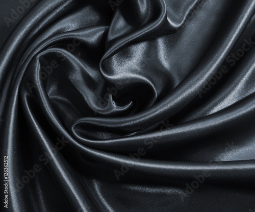 Smooth elegant dark grey silk or satin as background