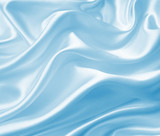 Smooth elegant blue silk or satin texture as background